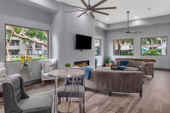 Clubhouse lounge with fireplace and modern furniture